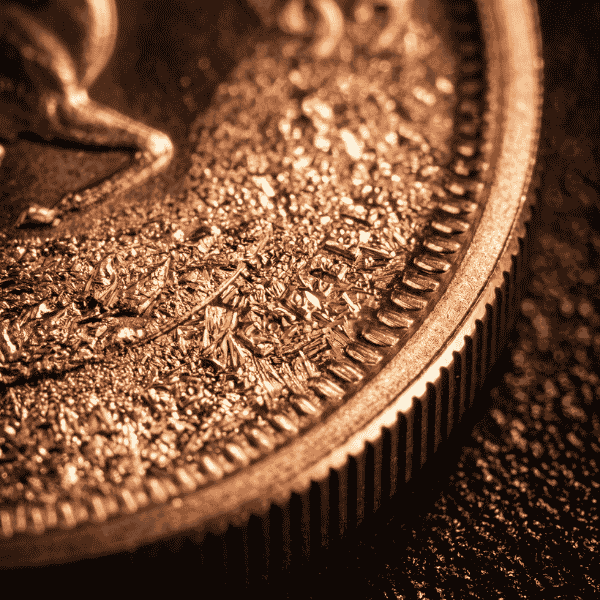 Macro inspection of 22k crown gold alloy structure preserving enduring gold krugerrand history value